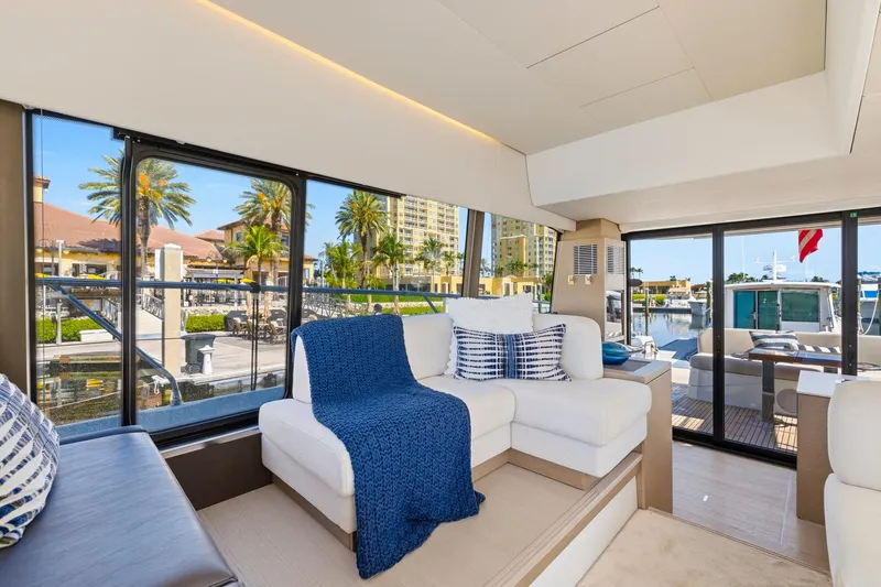 Slide: The Image of Luxurious interior of 2022 Prestige 520 yacht with elegant seating and marina view. - 45