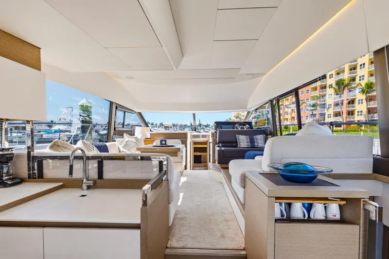Slide: The Image of Luxurious interior of 2022 Prestige 520 yacht with modern furnishings and panoramic windows. - 48
