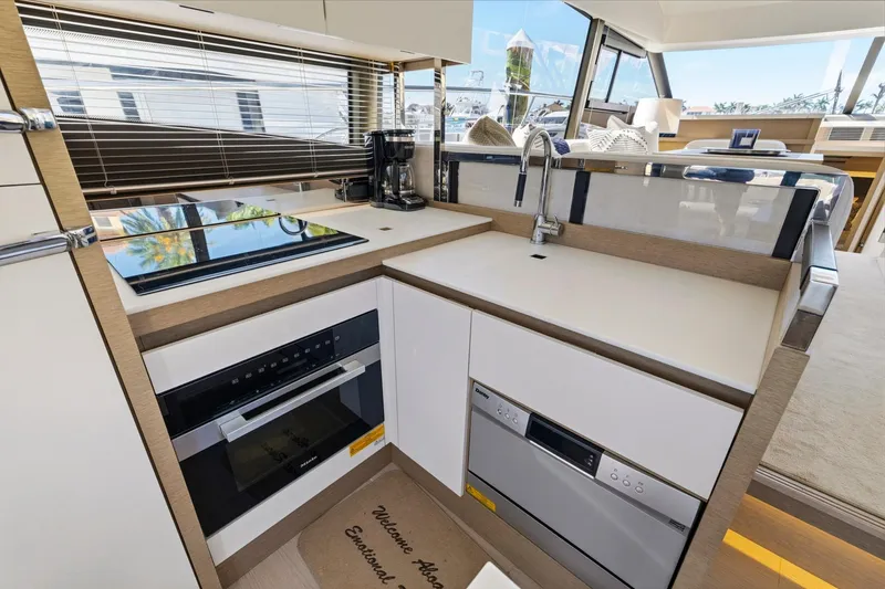 Slide: The Image of Modern kitchen in 2022 Prestige 520 yacht with sleek appliances and stylish design. - 49
