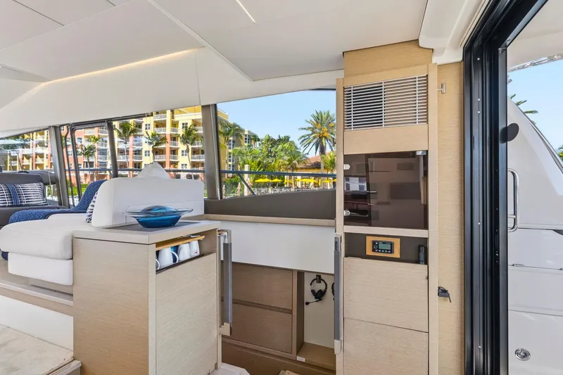 Slide: The Image of Luxurious interior of 2022 Prestige 520 yacht with modern furnishings and large windows. - 50