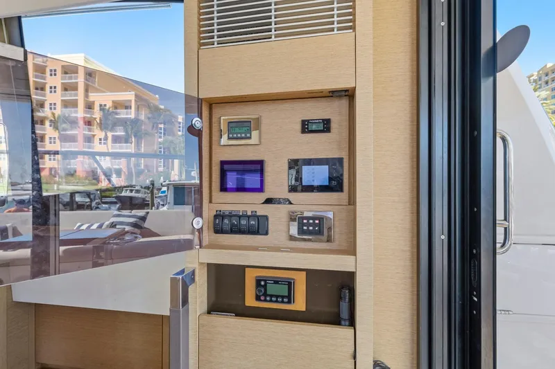 Slide: The Image of Control panel inside 2022 Prestige 520 yacht, featuring modern navigation and monitoring systems. - 51