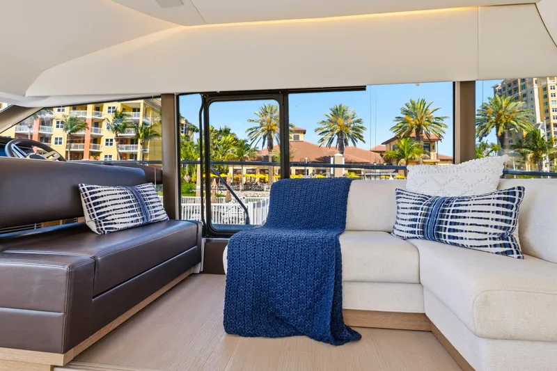 Slide: The Image of Luxurious interior of 2022 Prestige 520 yacht with elegant seating and scenic view. - 53