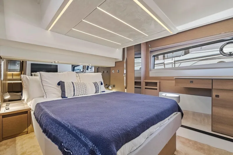 Slide: The Image of Luxurious 2022 Prestige 520 yacht bedroom with modern design and elegant furnishings. - 59