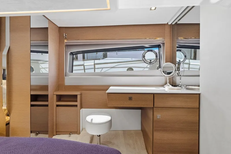 Slide: The Image of Luxurious interior of 2022 Prestige 520 yacht with vanity and seating. - 60