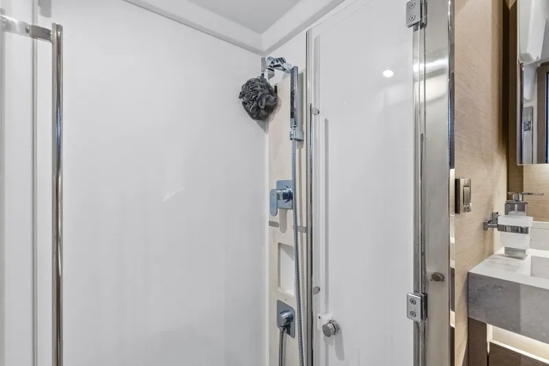 Slide: The Image of Modern shower area in 2022 Prestige 520 yacht, featuring sleek fixtures and elegant design. - 64