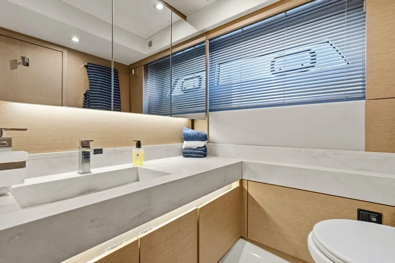 Slide: The Image of Luxurious bathroom in 2022 Prestige 520 yacht with modern fixtures and elegant design. - 65