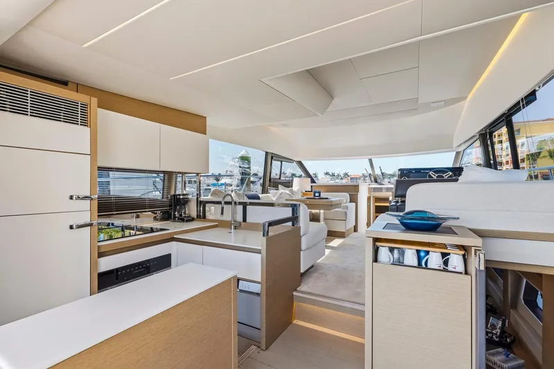 Slide: The Image of Luxurious interior of 2022 Prestige 520 yacht featuring modern kitchen and spacious seating area. - 66