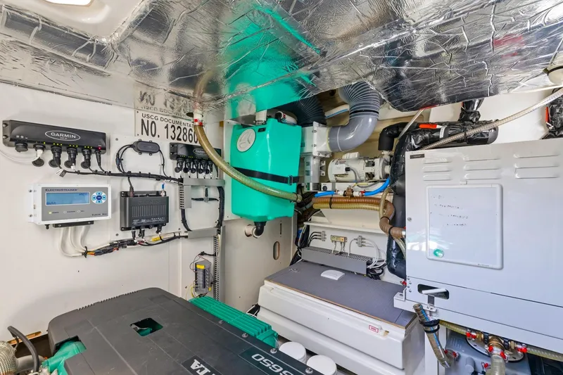 Slide: The Image of Engine room of 2022 Prestige 520 yacht with advanced equipment and wiring. - 71