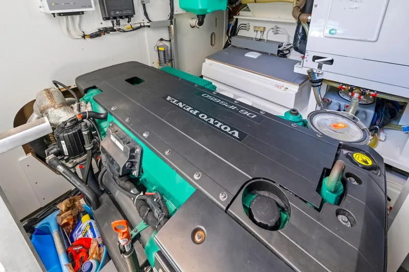 Slide: The Image of Engine room of a 2022 Prestige 520 yacht featuring a Volvo Penta engine. - 72