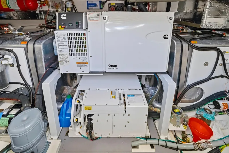 Slide: The Image of Engine room of a 2022 Prestige 520 yacht with Onan Marine generator. - 74
