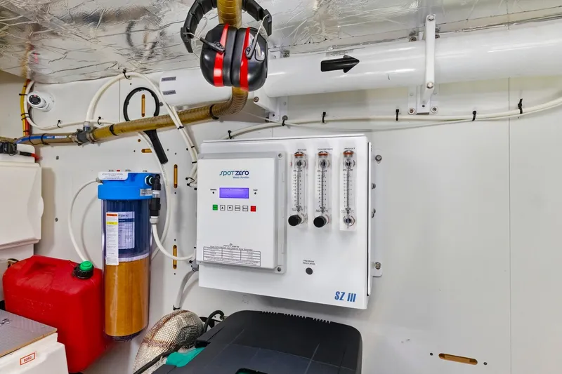 Slide: The Image of Engine room of 2022 Prestige 520 yacht with water purifier system and safety equipment. - 75