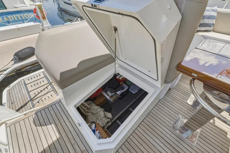 Slide: The Image of Open storage compartment on 2022 Prestige 520 yacht, showcasing organized interior space. - 79
