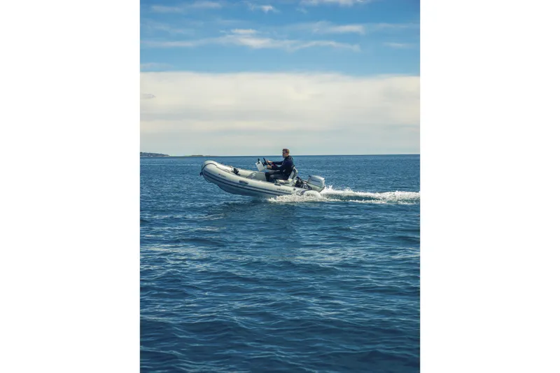 Slide: The Image of Highfield Classic 340 boat cruising on open water, 2026 model. - 3