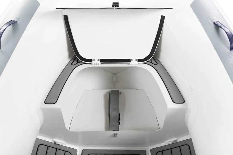 Slide: The Image of Manufacturer Provided Image: Interior view of 2025 Highfield Classic 340 boat, featuring storage compartment and sleek design. - 7
