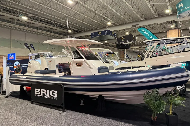 Slide: The Image of 2026 Brig Eagle 8 boat displayed at an indoor exhibition, showcasing sleek design and modern features. - 13