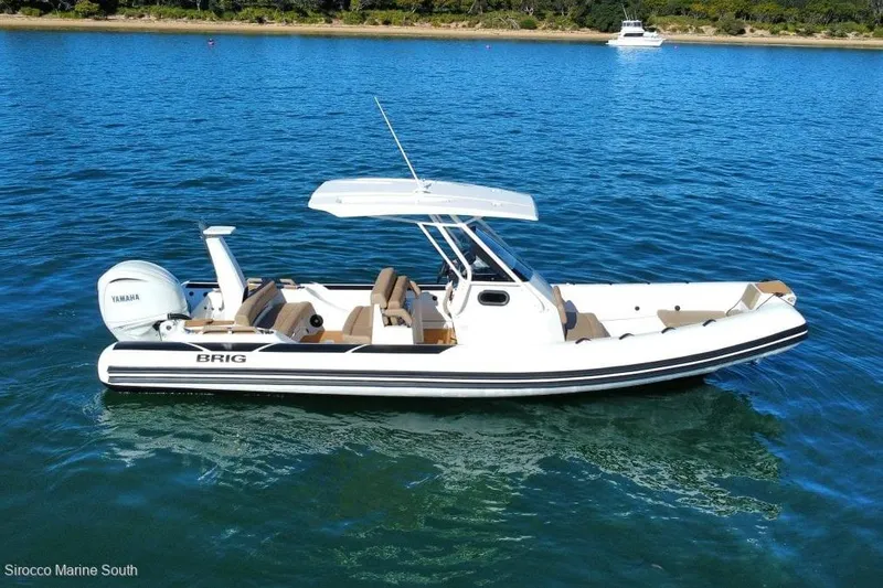 Slide: The Image of 2026 Brig Eagle 8 boat with Yamaha engine on calm blue water. - 16