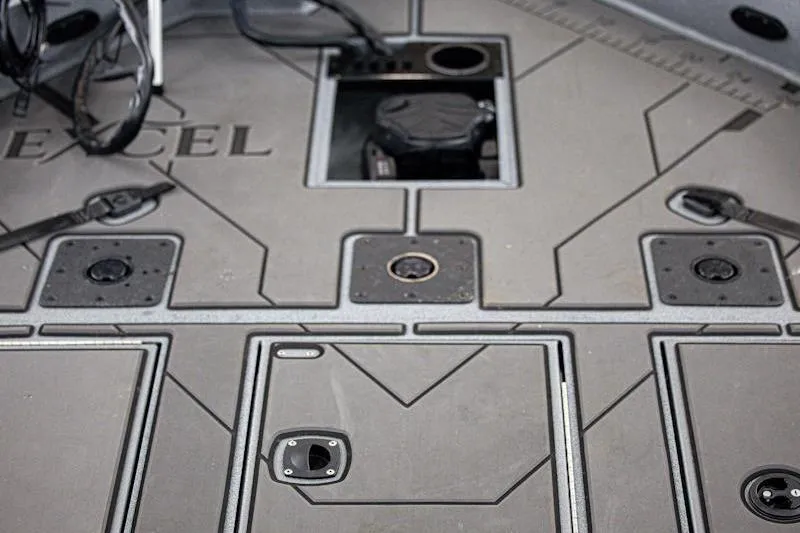Slide: The Image of Deck of Excel EX 203 boat, 2026 model, featuring storage compartments and sleek design. - 8