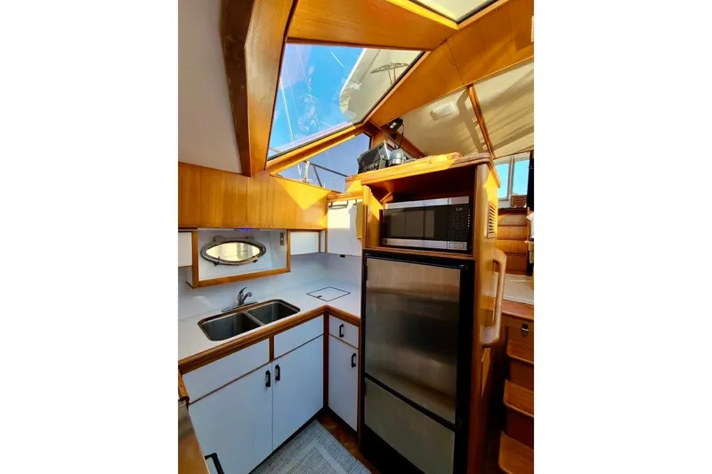 Slide: The Image of Interior of 1989 TransWorld 39 Flushdeck Motor Yacht with kitchenette and skylight. - 11