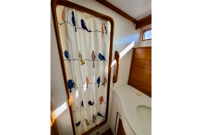 Slide: The Image of Shower area in 1989 TransWorld 39 Flushdeck Motor Yacht with bird-patterned curtain. - 15