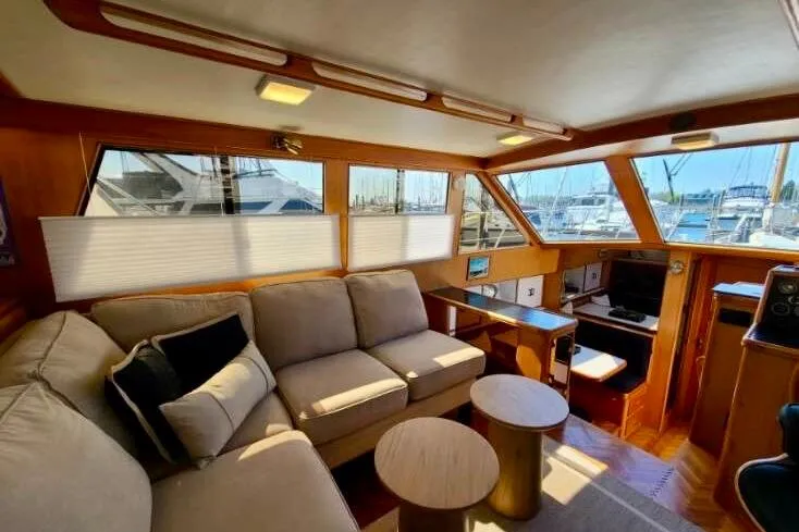 Slide: The Image of Luxurious interior of 1989 TransWorld 39 Flushdeck Motor Yacht with plush seating and scenic windows. - 4