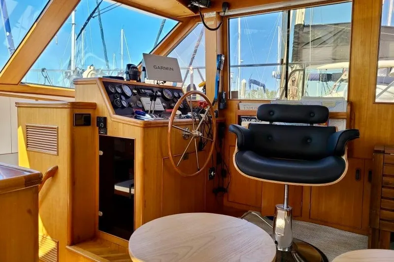 Slide: The Image of Helm of 1989 TransWorld 39 Flushdeck Motor Yacht with steering wheel and navigation equipment. - 6