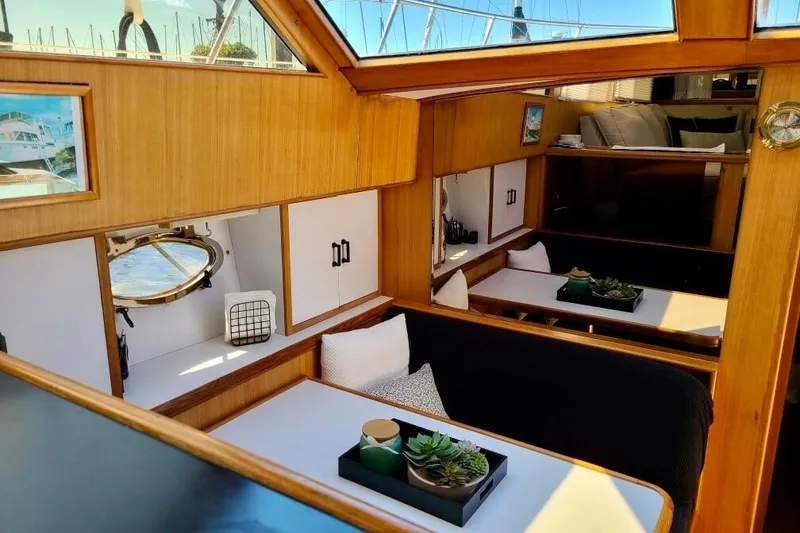 Slide: The Image of Interior of 1989 TransWorld 39 Flushdeck Motor Yacht with wooden finish and seating area. - 7