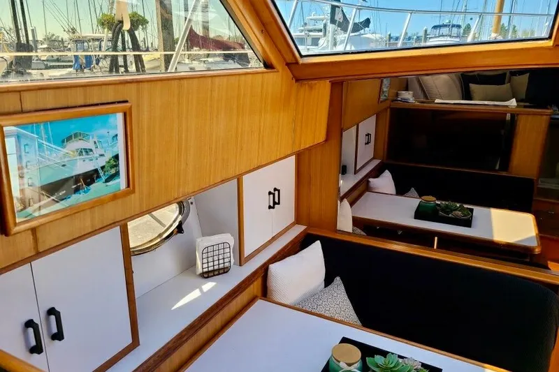 Slide: The Image of Interior of 1989 TransWorld 39 Flushdeck Motor Yacht with wood paneling and seating area. - 8