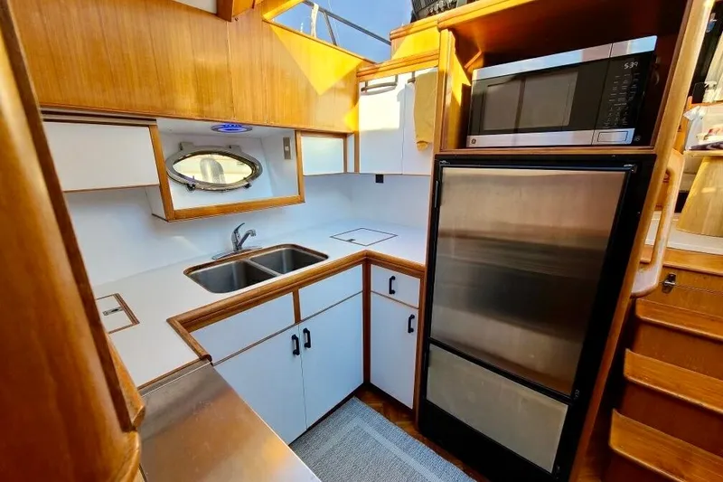 Slide: The Image of Galley kitchen in 1989 TransWorld 39 Flushdeck Motor Yacht with stainless steel appliances. - 9