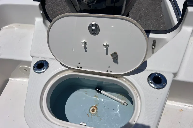Slide: The Image of Open storage compartment on a 2017 Boston Whaler 170 Montauk boat. - 15