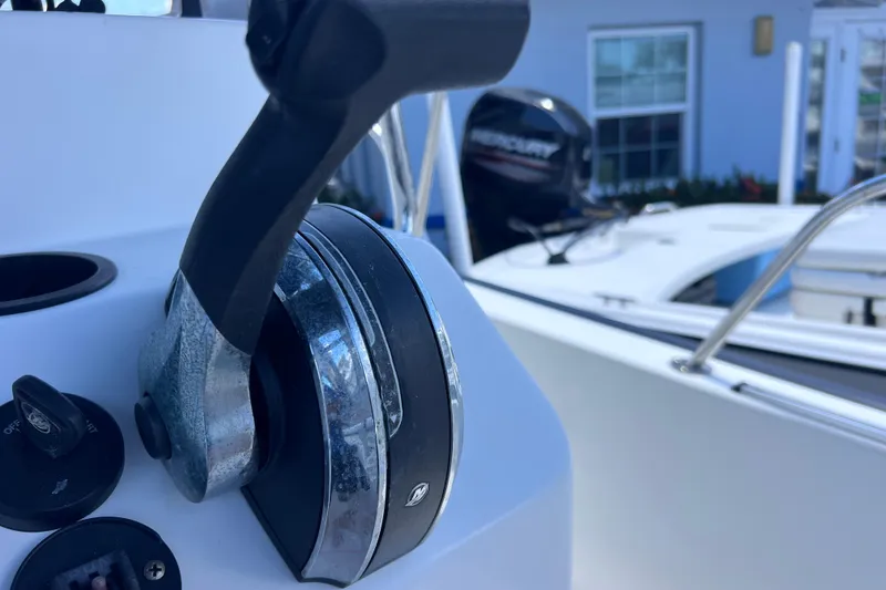 Slide: The Image of Close-up of 2017 Boston Whaler 170 Montauk boat throttle and controls. - 19