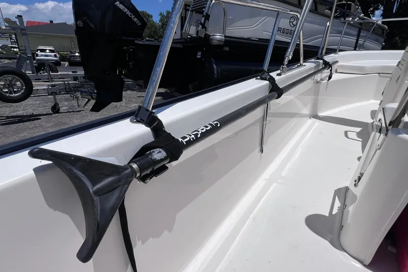Slide: The Image of 2017 Boston Whaler 170 Montauk interior with mounted paddle and railing. - 22