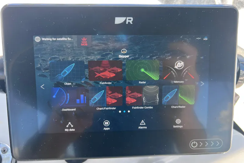 Slide: The Image of Touchscreen display on a 2017 Boston Whaler 170 Montauk, showing navigation and fishfinder apps. - 25