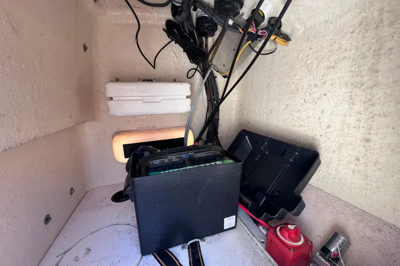 Slide: The Image of Interior view of a 2017 Boston Whaler 170 Montauk boat showing battery and wiring. - 28