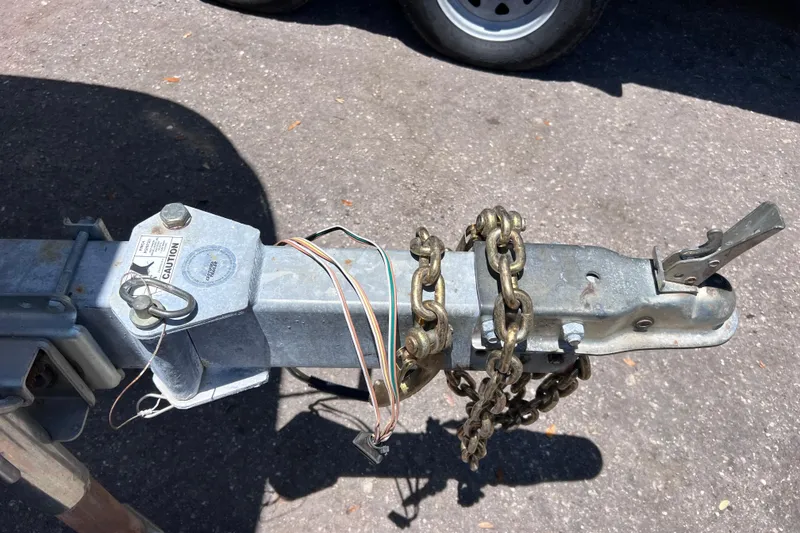Slide: The Image of Trailer hitch with chains and wiring for 2017 Boston Whaler 170 Montauk boat. - 31