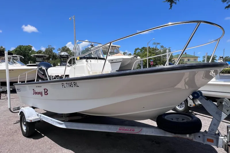 Slide: The Image of 2017 Boston Whaler 170 Montauk boat on trailer, sunny day, clear blue sky. - 6