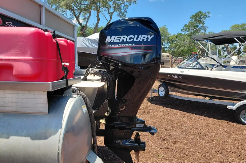 Slide: The Image of 2019 Sun Tracker Bass Buggy 16 DLX with Mercury FourStroke outboard motor, parked outdoors. - 10