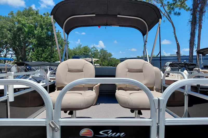 Slide: The Image of 2019 Sun Tracker Bass Buggy 16 DLX pontoon boat with beige seats and canopy. - 11
