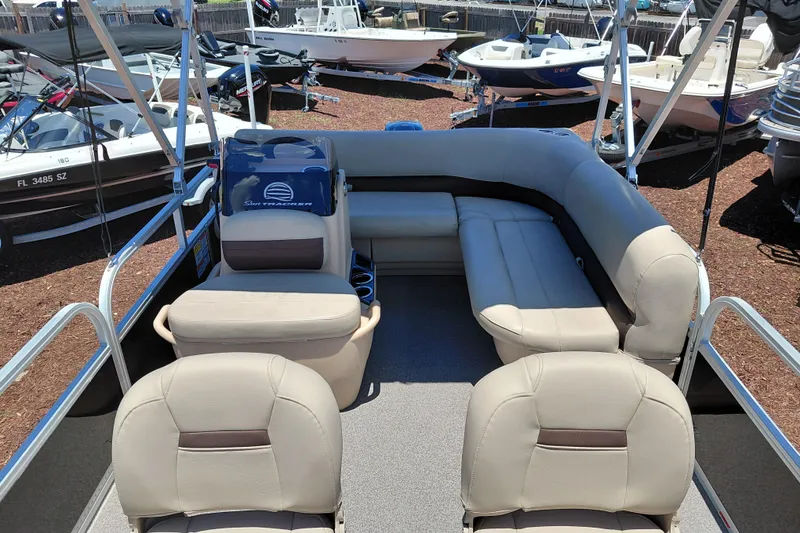 Slide: The Image of 2019 Sun Tracker Bass Buggy 16 DLX pontoon boat interior with beige seating. - 13