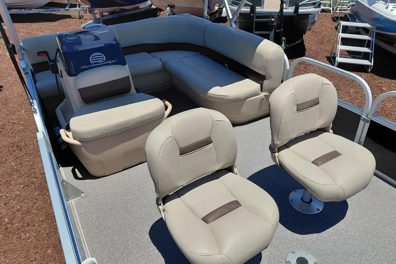 Slide: The Image of 2019 Sun Tracker Bass Buggy 16 DLX pontoon boat interior with beige seating. - 14