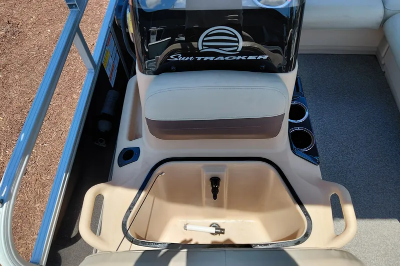 Slide: The Image of 2019 Sun Tracker Bass Buggy 16 DLX interior with seating and storage compartments. - 18