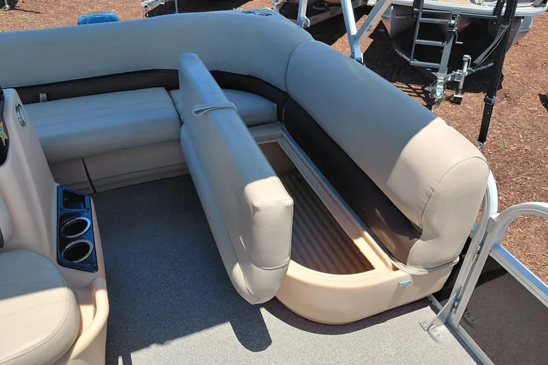 Slide: The Image of 2019 Sun Tracker Bass Buggy 16 DLX pontoon boat interior with storage under seats. - 20
