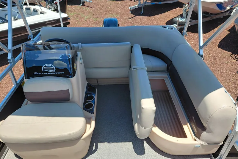 Slide: The Image of 2019 Sun Tracker Bass Buggy 16 DLX pontoon boat interior with seating and console. - 22