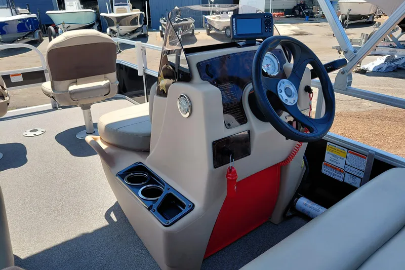 Slide: The Image of 2019 Sun Tracker Bass Buggy 16 DLX boat interior with steering console and seating. - 25