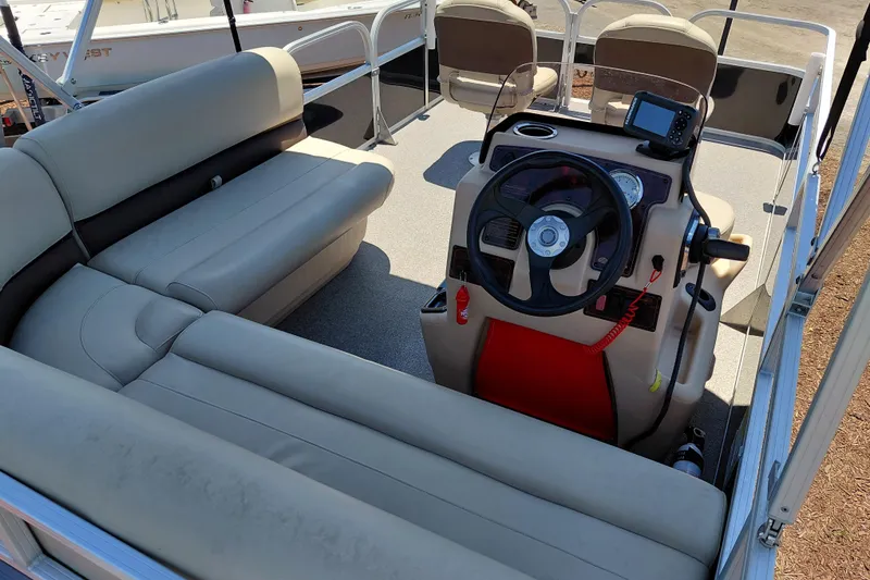 Slide: The Image of 2019 Sun Tracker Bass Buggy 16 DLX interior with steering console and seating. - 30