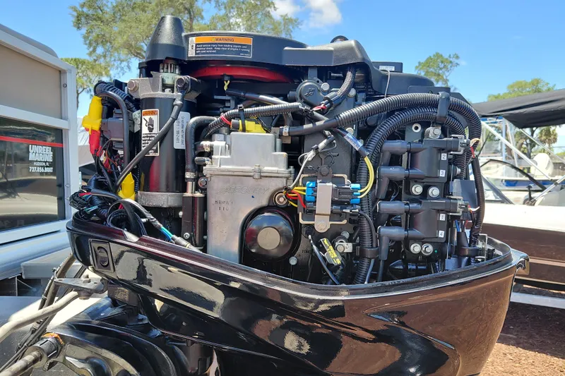 Slide: The Image of Close-up of a 2019 Sun Tracker Bass Buggy 16 DLX boat engine. - 34