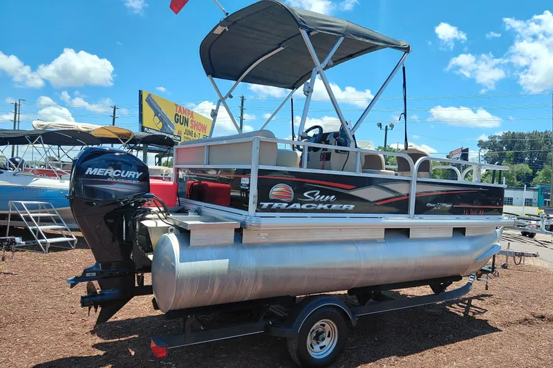 Slide: The Image of 2019 Sun Tracker Bass Buggy 16 DLX pontoon boat with Mercury engine on display. - 8