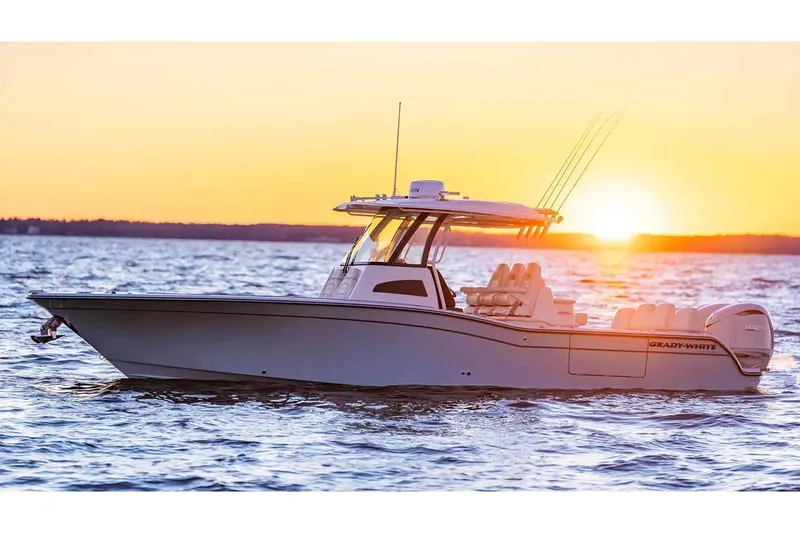 Slide: The Image of Manufacturer Provided Image: 2026 Grady-White 321 Coastal Explorer boat at sunset on the water. - 2