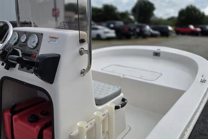 Slide: The Image of 2025 Carolina Skiff E18 JVX CC boat interior with steering console and seating. - 16