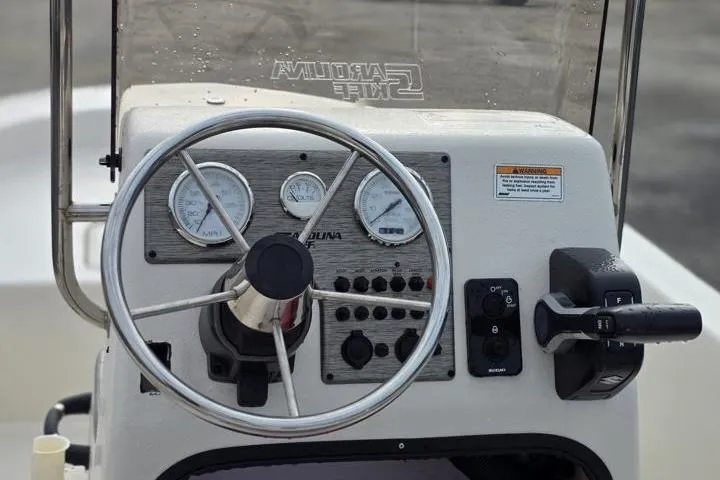 Slide: The Image of Steering console of 2025 Carolina Skiff E18 JVX CC boat with gauges and controls. - 20