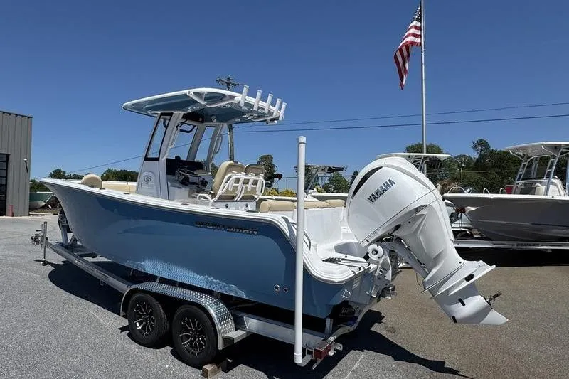 Slide: The Image of 2026 Sportsman Heritage 231 Center Console boat on trailer, with Yamaha outboard motor. - 10